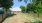 enclosed dog park outside with white picnic chairs 